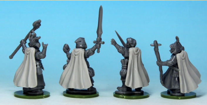 When the superglue had set, I assembled the rest of the wizard’s parts. I had to trim some arms to get them to fit around the cloaks, and I used some of the extra like packs and bags to disguise the flat back of the cloak. 
