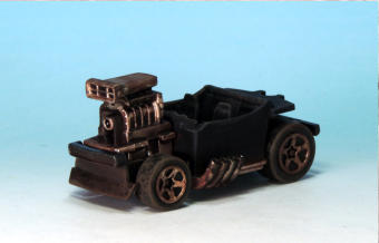 The next step was to give the chassis and wheels a wash of Army Painter Quickshade Mid Brown Wash, and the end of the exhausts a daub of Dark Tone Quickshade. 