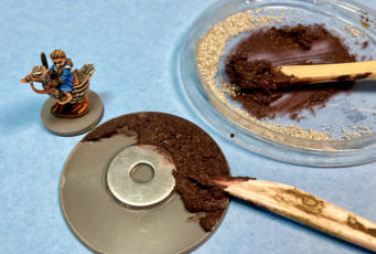 I use a home-made mix of acrylic paint, filler and chinchilla sand to build up texture on my bases.