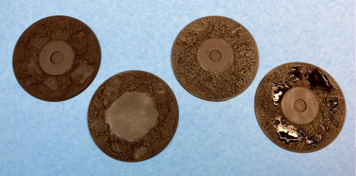 Above. Dry brushing to bring the bases to life: stages: 1) plain base, 2) Leather Brown drybrush, 3) Barren Dune drybrush, 4) ink and gloss varnish]