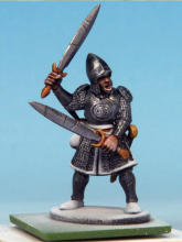 The flesh is painted with Crusader Skin. I applied a coat of Crusader Skin to the sword hilts, buckles, and sections of the greaves, muting the Glittering Loot and sharpening the details.