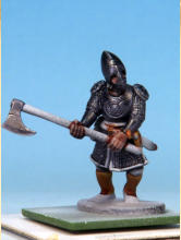 The flesh is painted with Crusader Skin. I applied a coat of Crusader Skin to the sword hilts, buckles, and sections of the greaves, muting the Glittering Loot and sharpening the details.