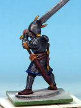 Eyes and teeth in Fanatic: Matt White. Circlet, amulet, horn fittings in Golden Armour. Weapon hafts, sword grips, shield backs in Dark Wood. Horn in Pallid Bone (two coats). Rock in Ashen Stone. Jewel in circlet in Carmine Dragon.