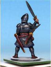 Eyes and teeth in Fanatic: Matt White. Circlet, amulet, horn fittings in Golden Armour. Weapon hafts, sword grips, shield backs in Dark Wood. Horn in Pallid Bone (two coats). Rock in Ashen Stone. Jewel in circlet in Carmine Dragon.