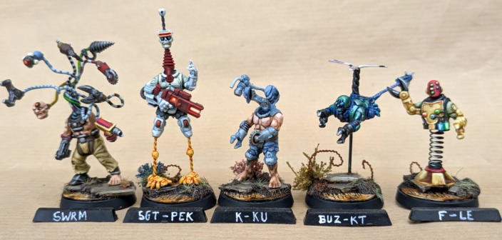 Simon Fairweather. Flybotz. Clever conversions that stay true to the Automaton aesthetic, Well painted using bright colours to emphasise the craziness of the group, Unified basing ties the unique models together beautifully, Just great fun to look at.