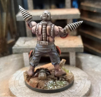David Culham. Driller. The muted vermillion plays off the grey and skin tones with real finesse. Easily one of the best bases in the batch with a great Automite.