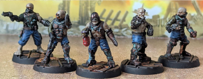 Christopher Chetwood. Pit Slave Crew. Two units painted! The vibrant blue of the first unit contrast nicely with the dirty overall look of the unit. 
