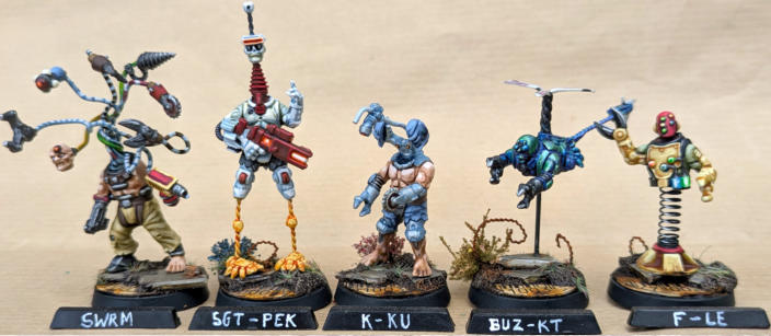 Simon Fairweather. Flybotz. Clever conversions that stay true to the Automaton aesthetic, Well painted using bright colours to emphasise the craziness of the group, Unified basing ties the unique models together beautifully.