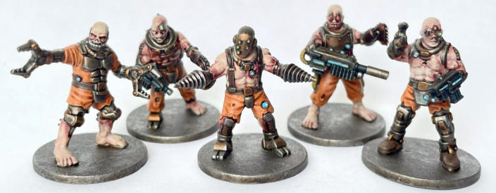 Mark Billen. Inmate Experiment 1138. Well painted bruised/angry skin tones, orange used well to sell convict idea and good use of food blue as a spot colour across the unit.