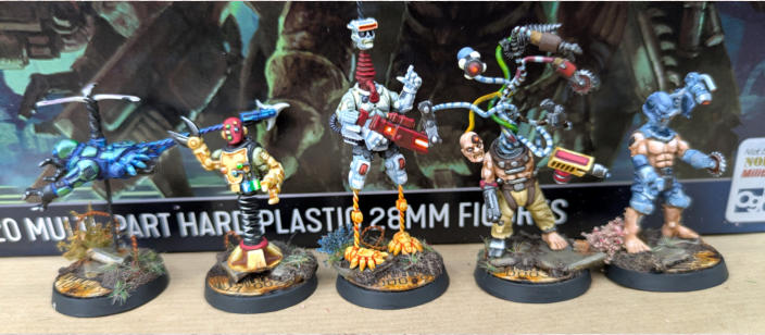 Simon Fairweather. Flybotz. Clever conversions that stay true to the Automaton aesthetic, Well painted using bright colours to emphasise the craziness of the group, Unified basing ties the unique models together beautifully, Just great fun to look at.