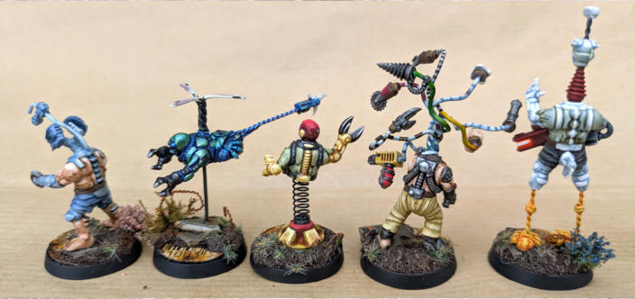 Simon Fairweather. Flybotz. Clever conversions that stay true to the Automaton aesthetic, Well painted using bright colours to emphasise the craziness of the group, Unified basing ties the unique models together beautifully, Just great fun to look at.